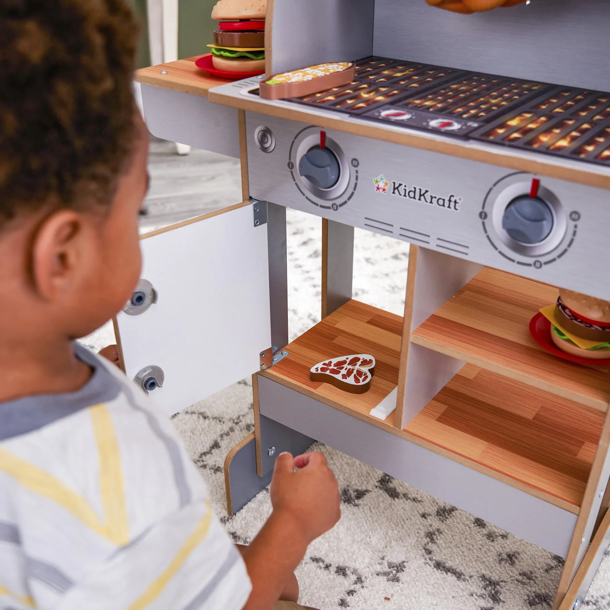 KidKraft Spin & Reveal Wooden Grill & Play Kitchen with Water-Reveal Food & 21 Accessories